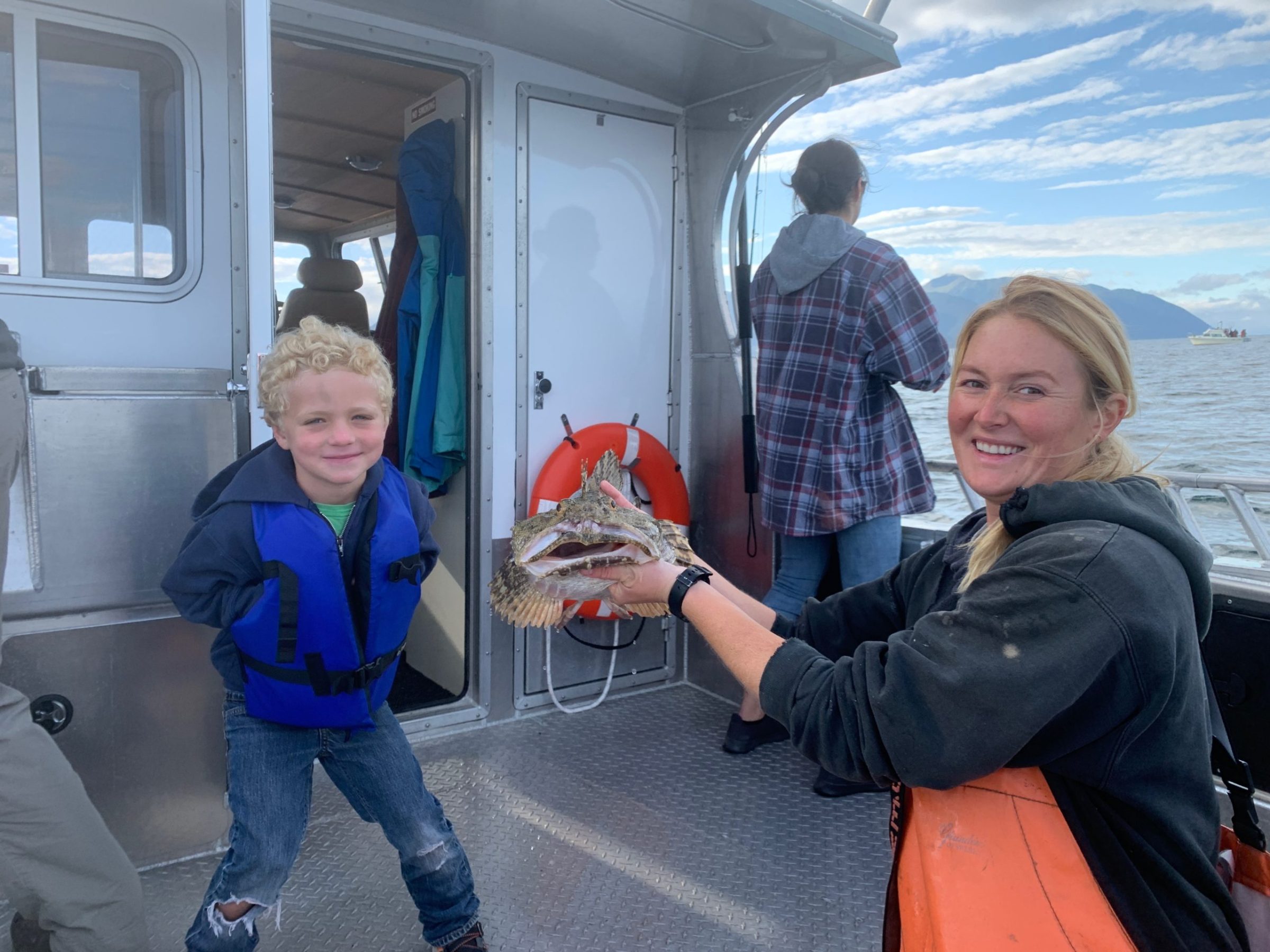 a group of people standing around a bus
