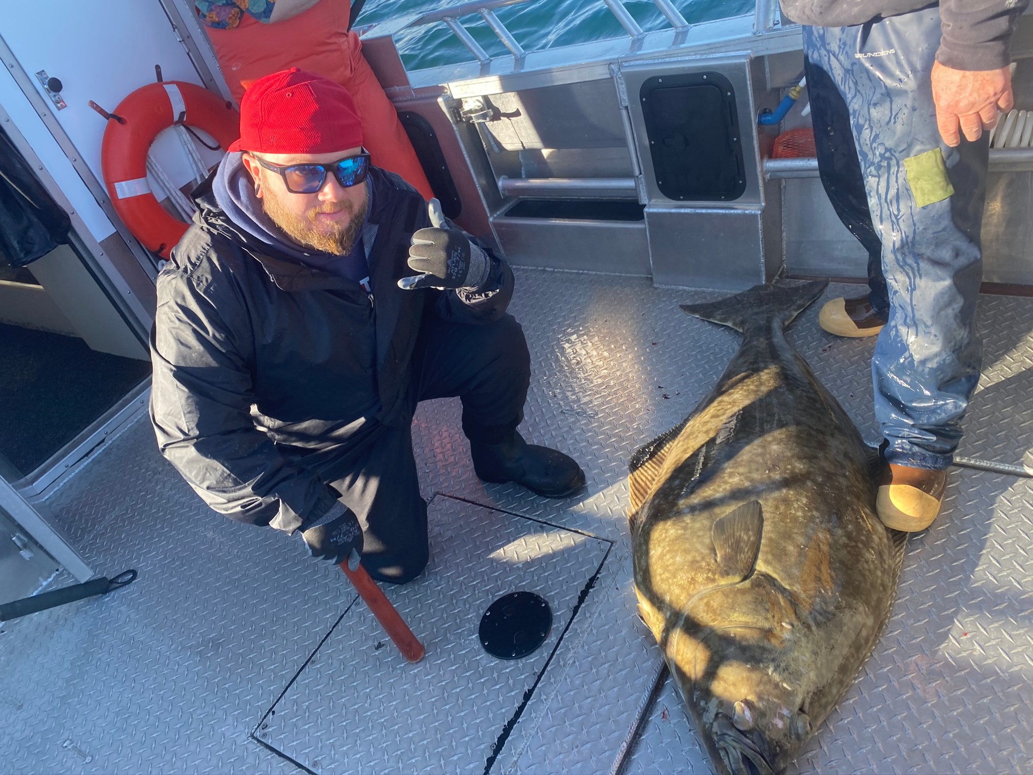 a man sitting in a parking lot
