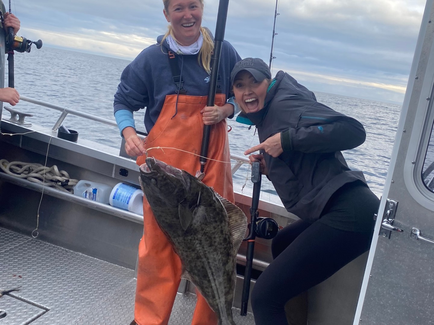 a person standing next to a boat
