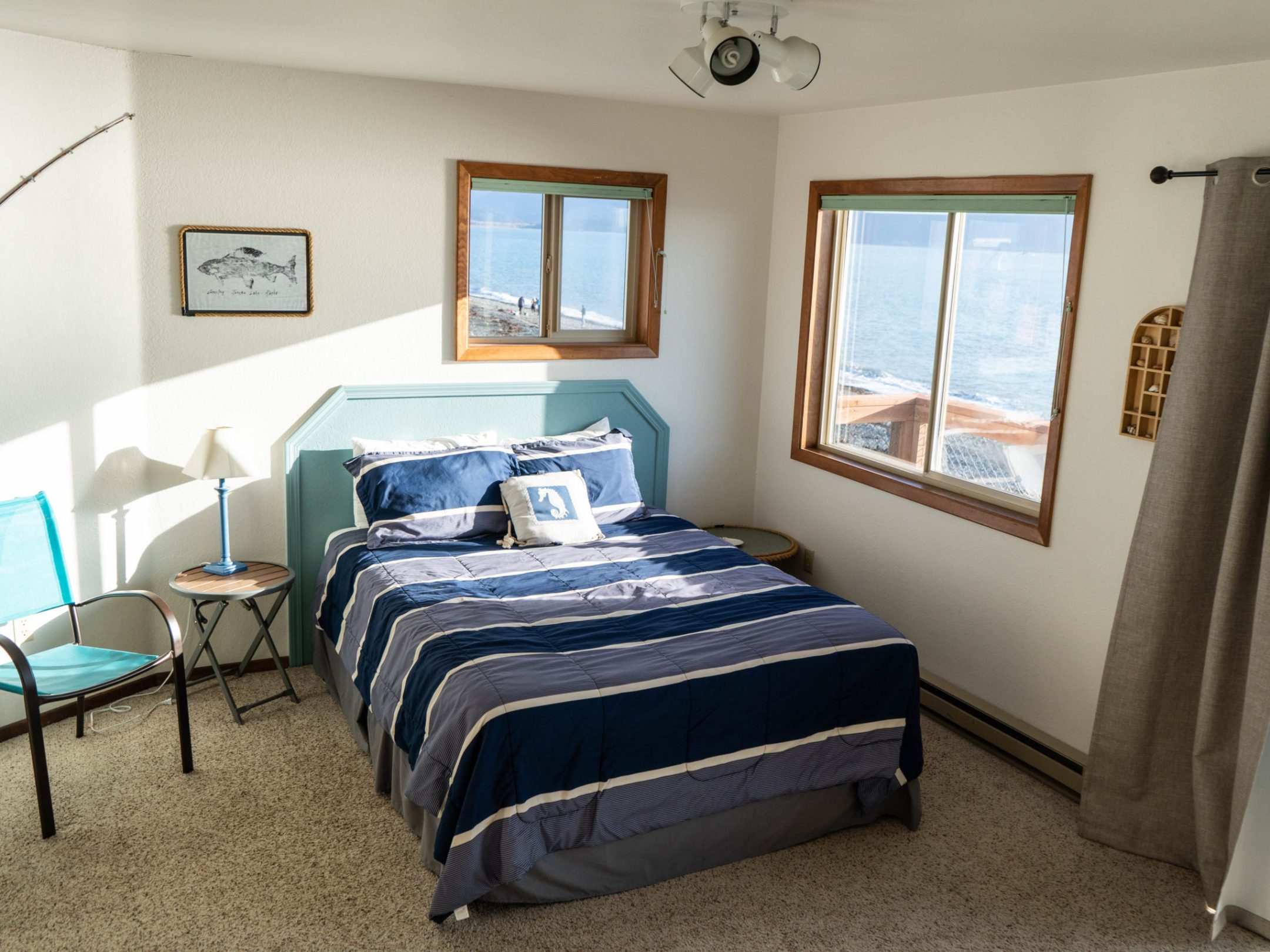 a bedroom with a bed and desk in a room