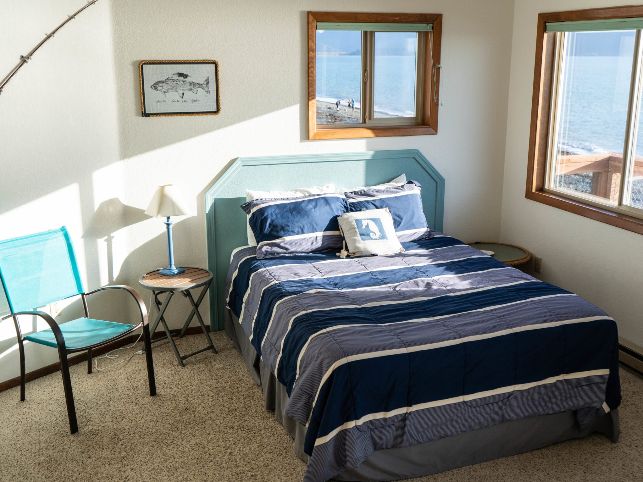 a bedroom with a bed and desk in a room