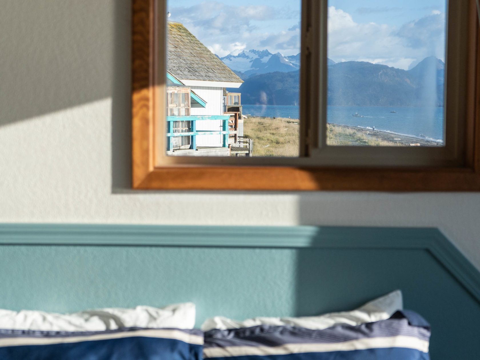 a bedroom with a bed and a window