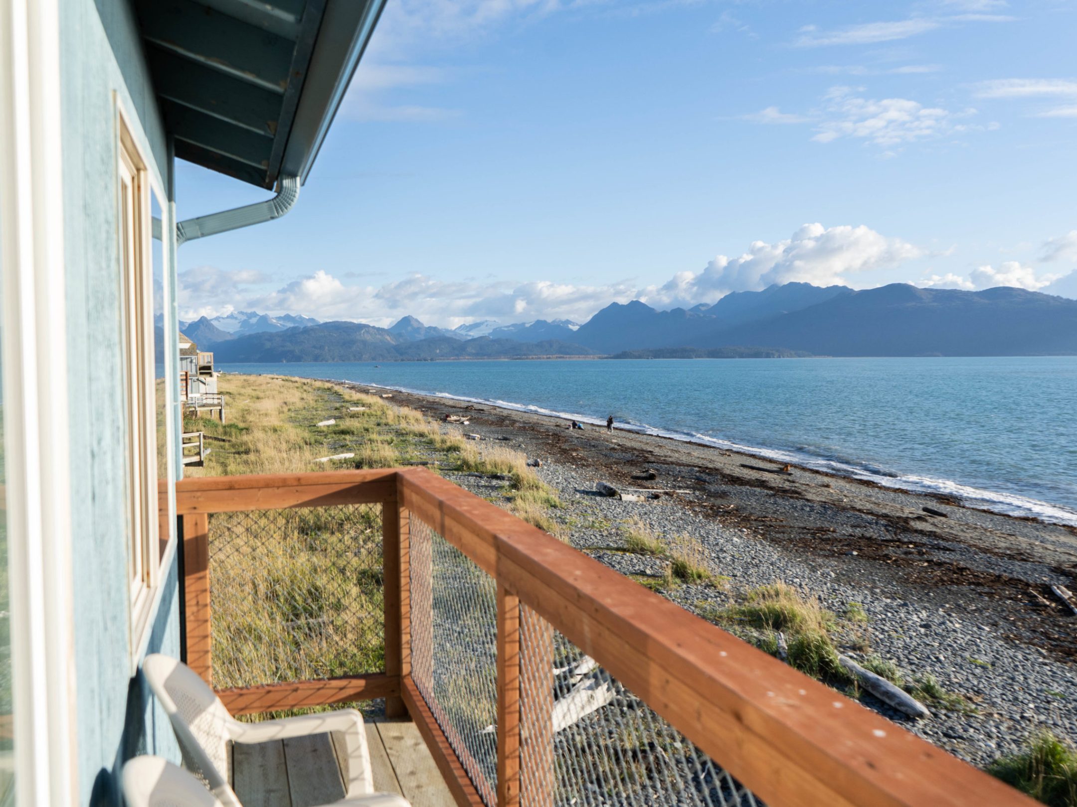 a bridge over a body of water with a mountain in the background
