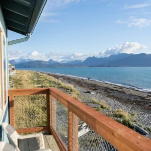 a bridge over a body of water with a mountain in the background