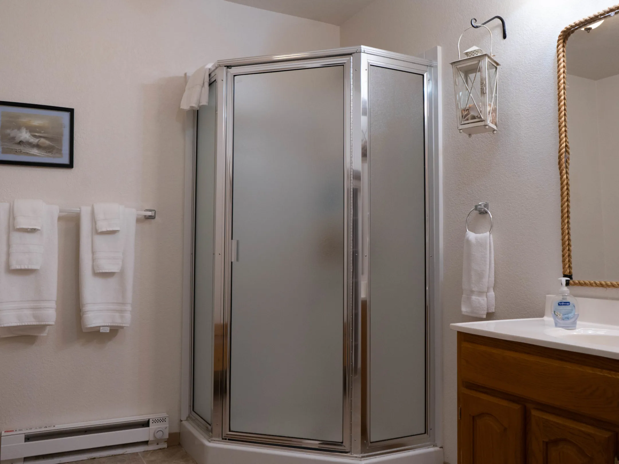 a room with a sink and a mirror