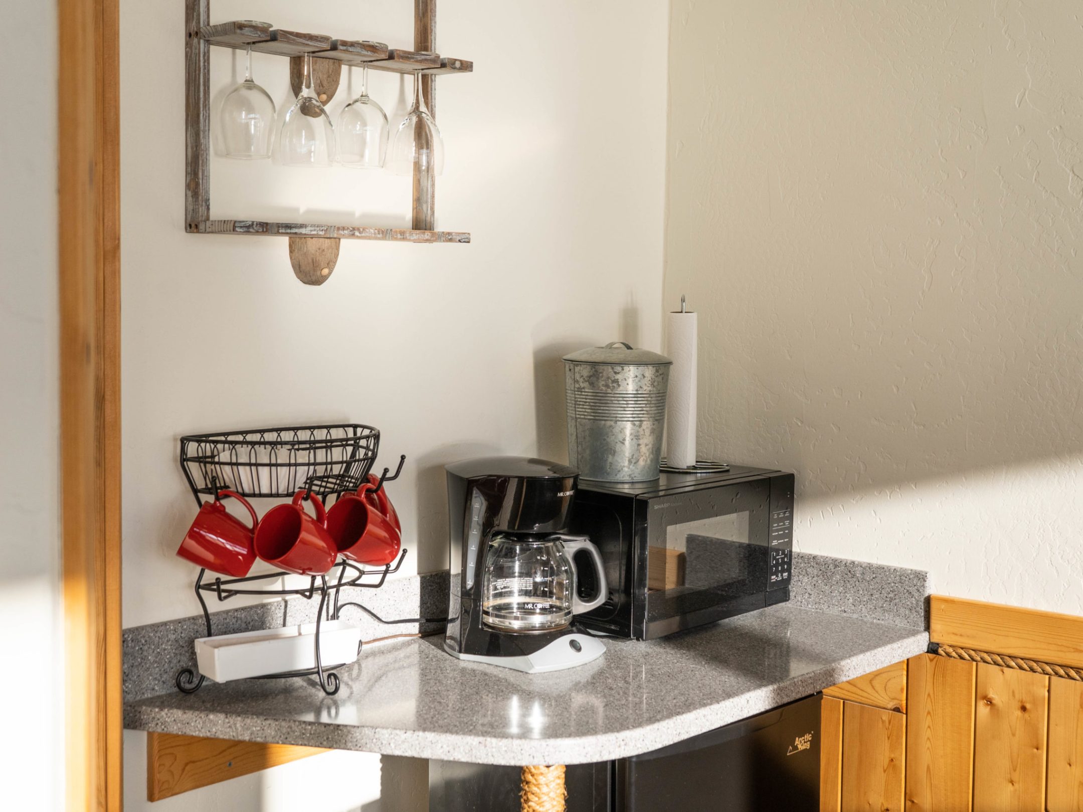 a kitchen with a sink and a mirror