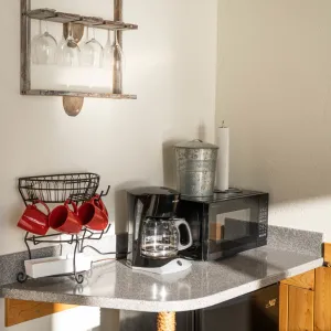 a kitchen with a sink and a mirror