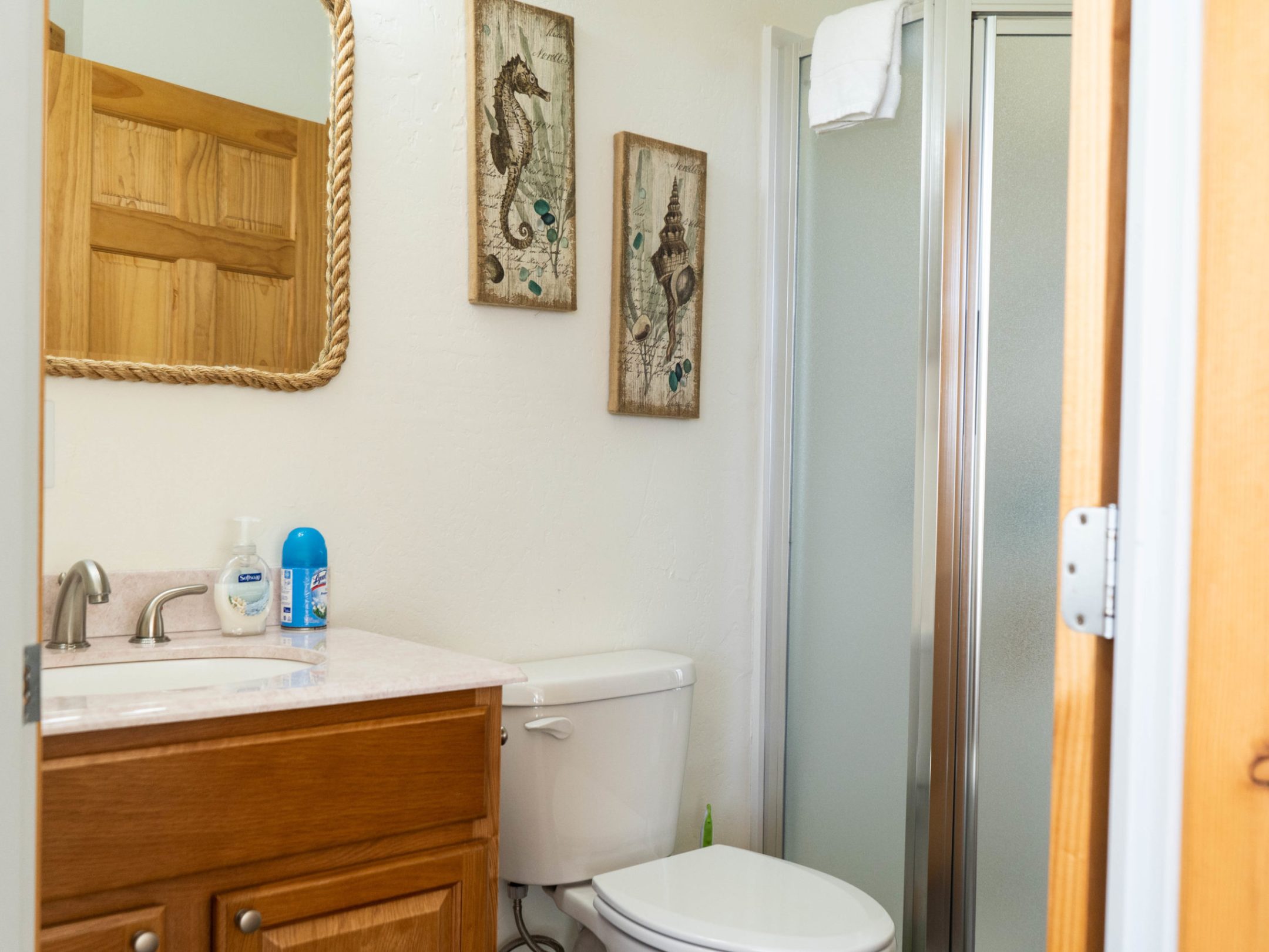 a room with a sink and a mirror