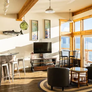 a room filled with furniture and a large window