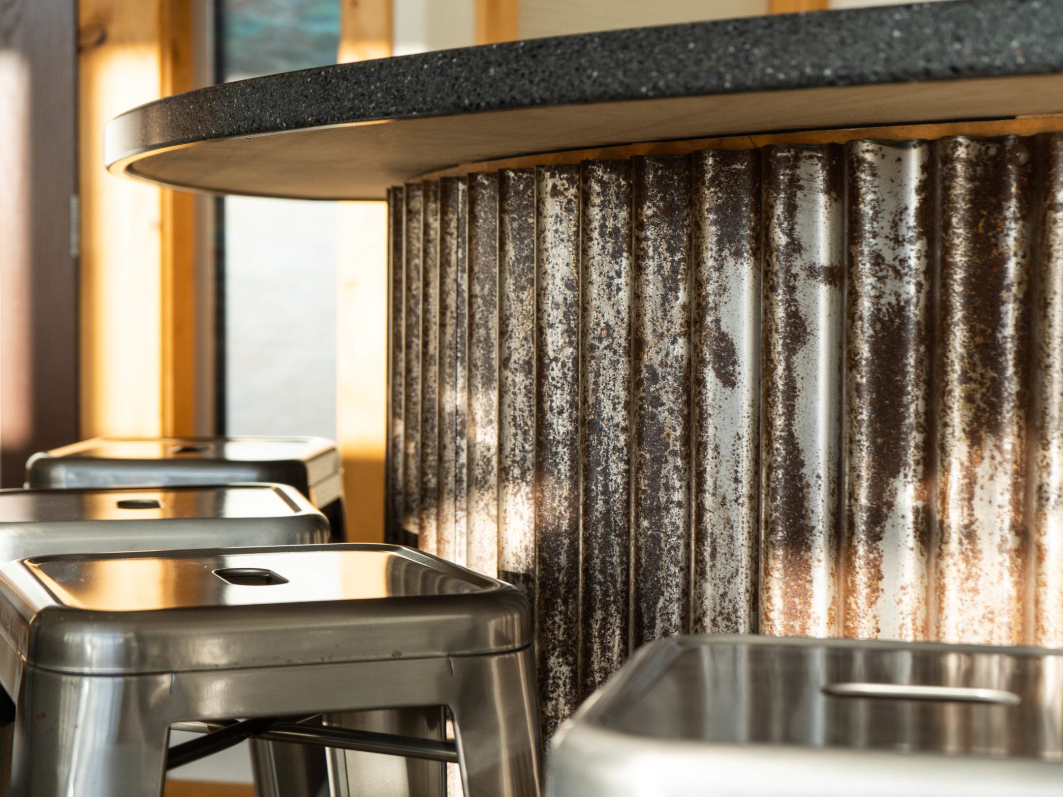 a stove top oven sitting next to a window