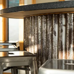 a stove top oven sitting next to a window