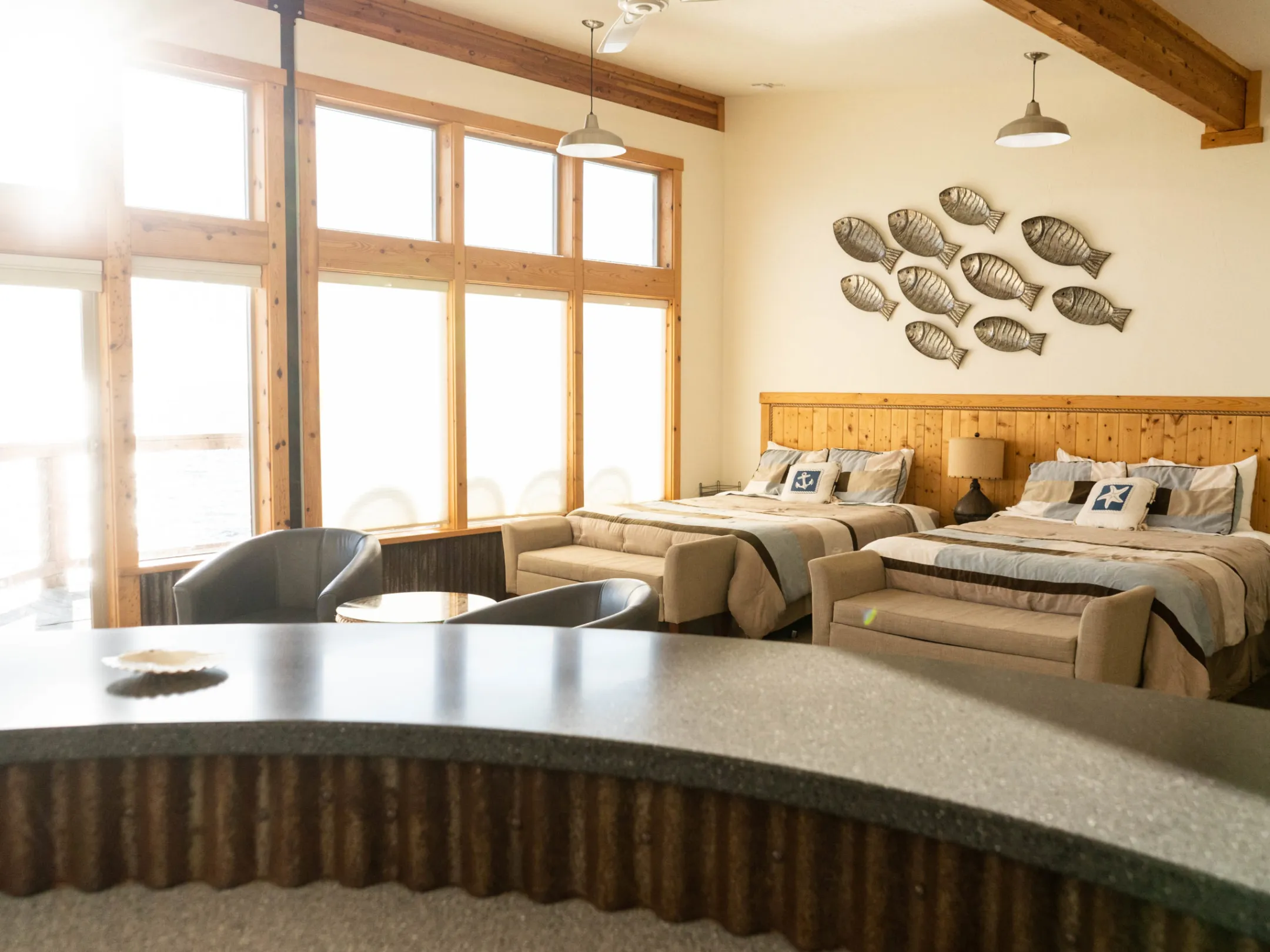 a living room filled with furniture and a large window