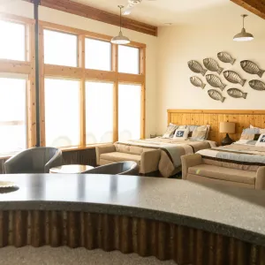 a living room filled with furniture and a large window