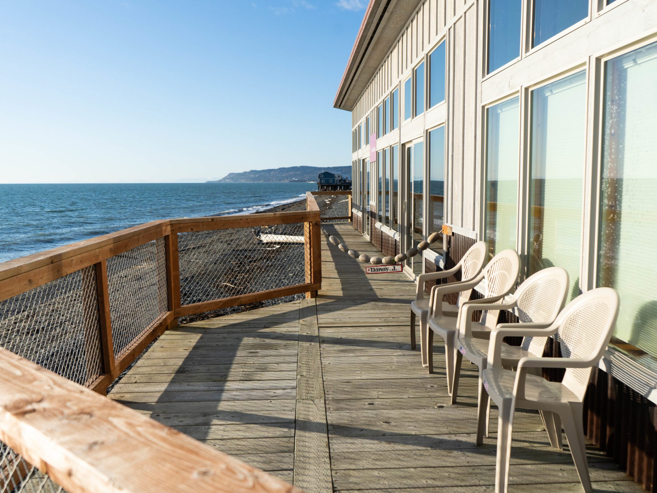 a wooden bench sitting next to a body of water