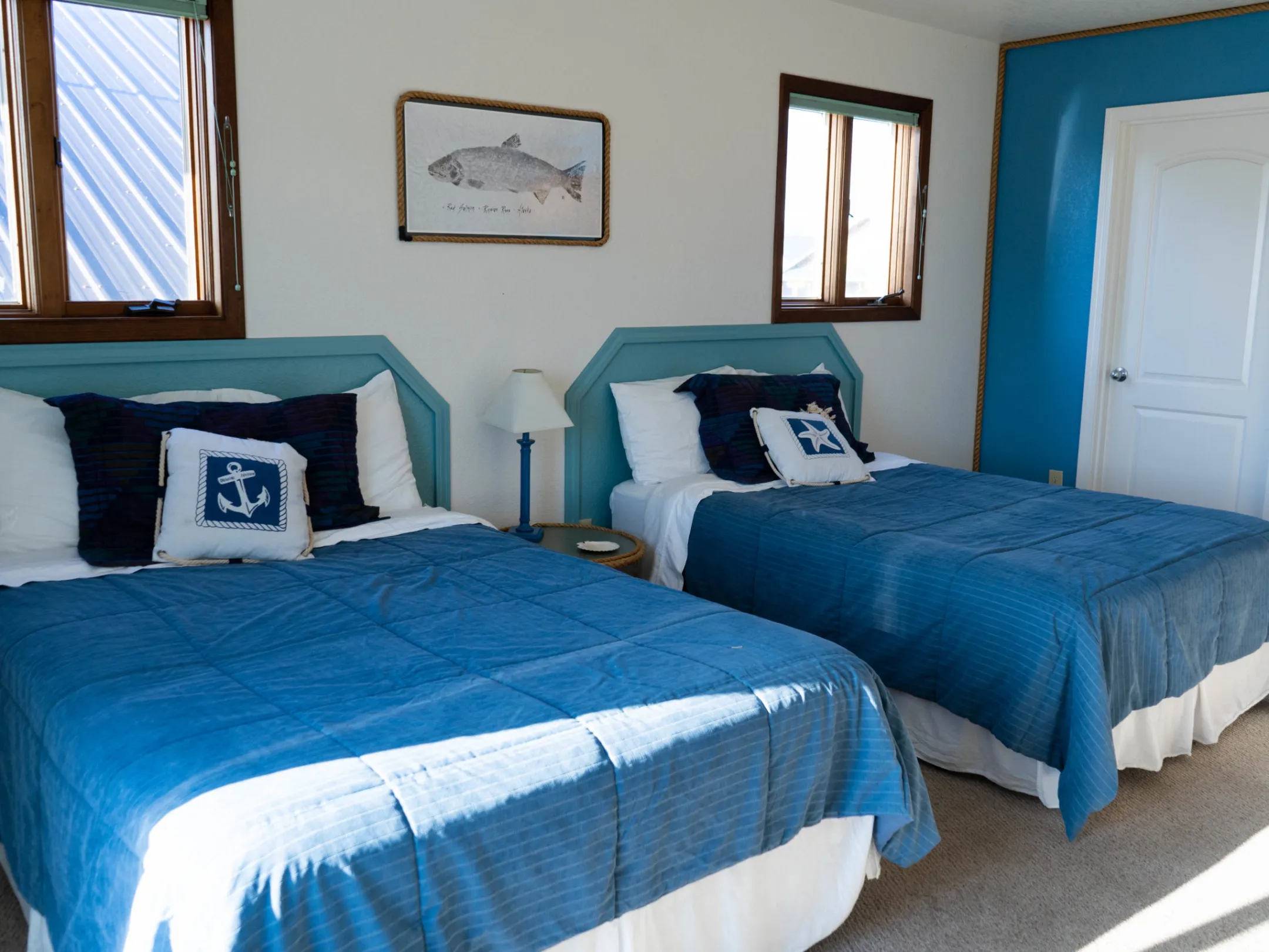 a bedroom with a bed and a blue blanket