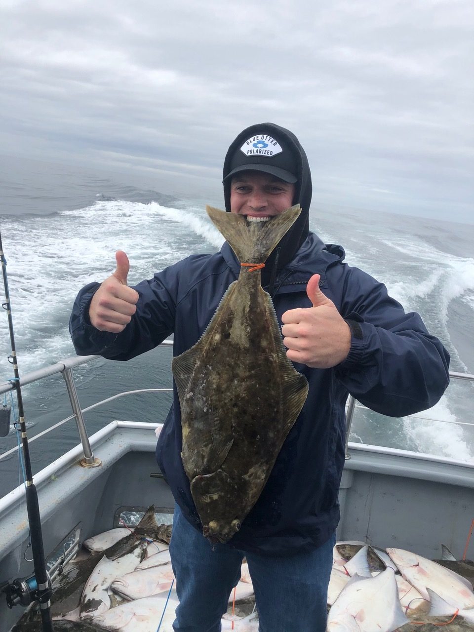 a man holding a fish in the water