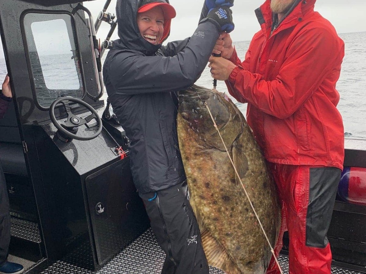 a couple of people that are standing in the snow