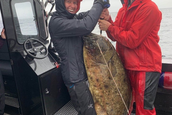 a couple of people that are standing in the snow