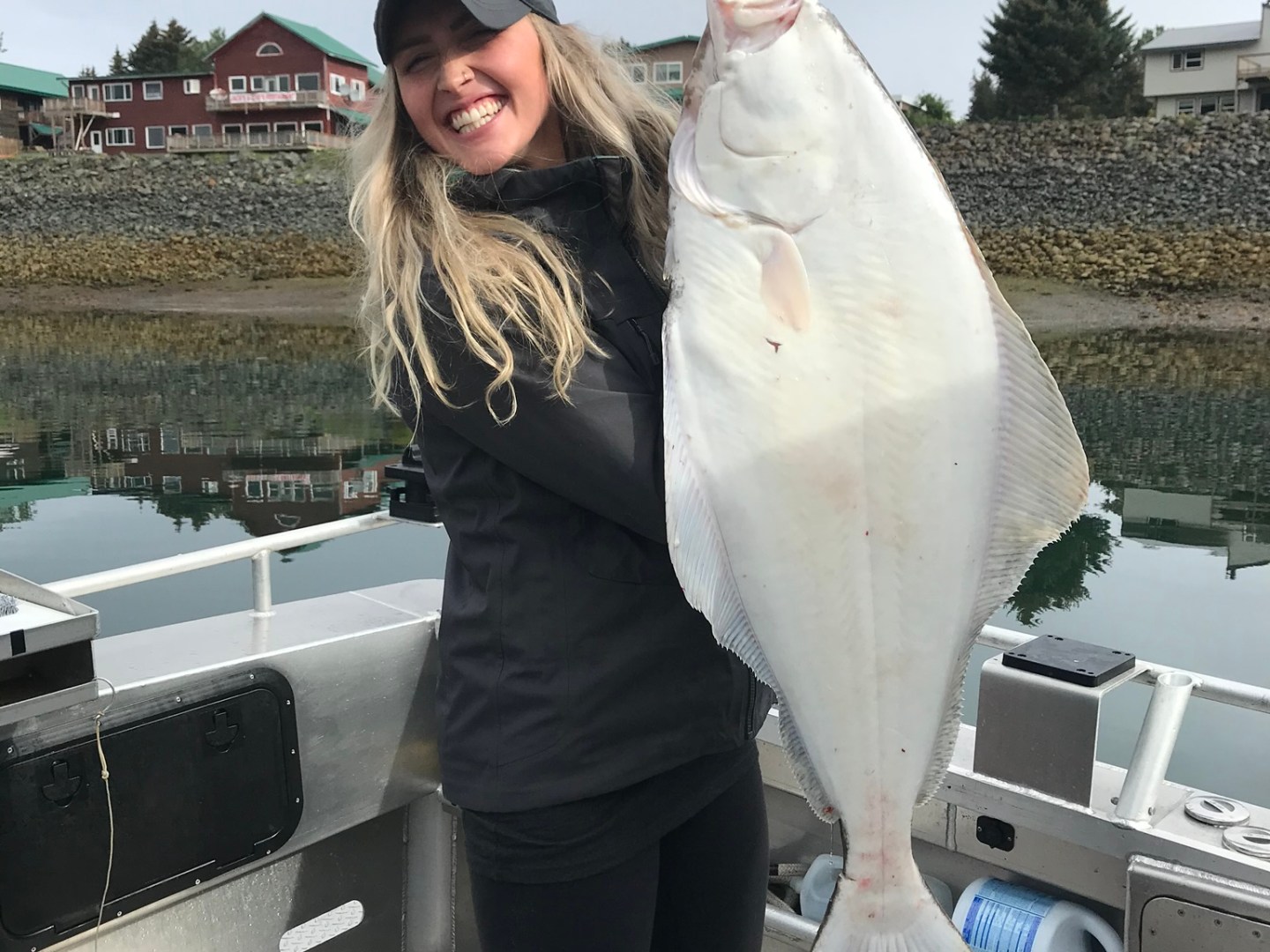 a person standing in front of a fish