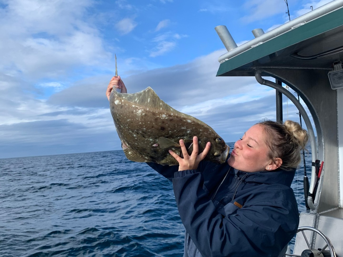 a person standing next to a body of water
