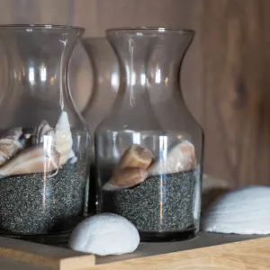 a vase sitting on top of a wooden table