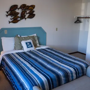 a bedroom with a bed in a room