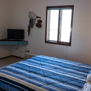 a bedroom with a bed in a room