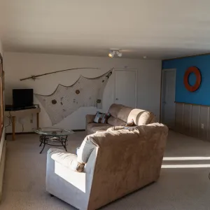 a living room filled with furniture and a bed