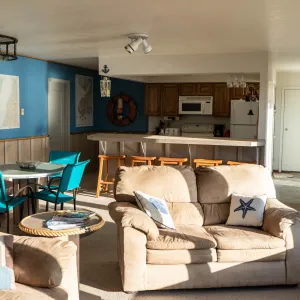 a living room filled with furniture and a fireplace