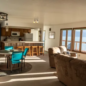 a living room filled with furniture and a large window