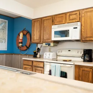 a kitchen with a sink and a microwave