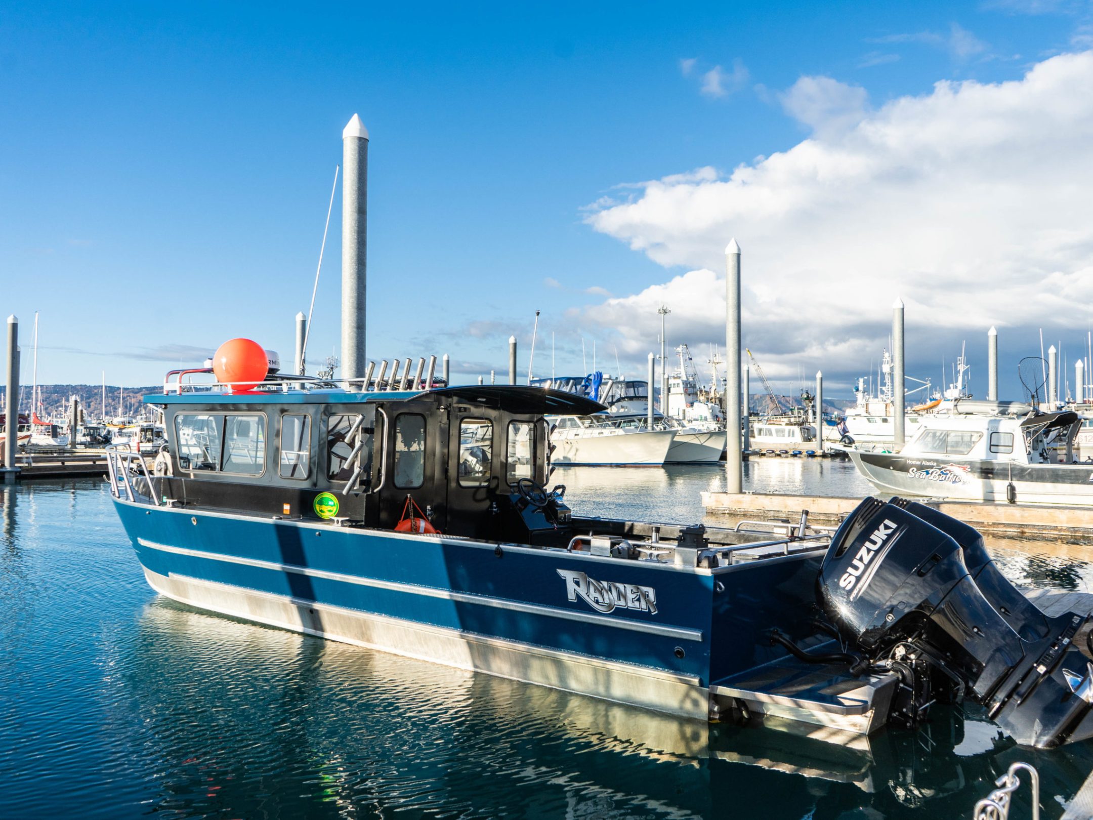a boat is docked next to a body of water
