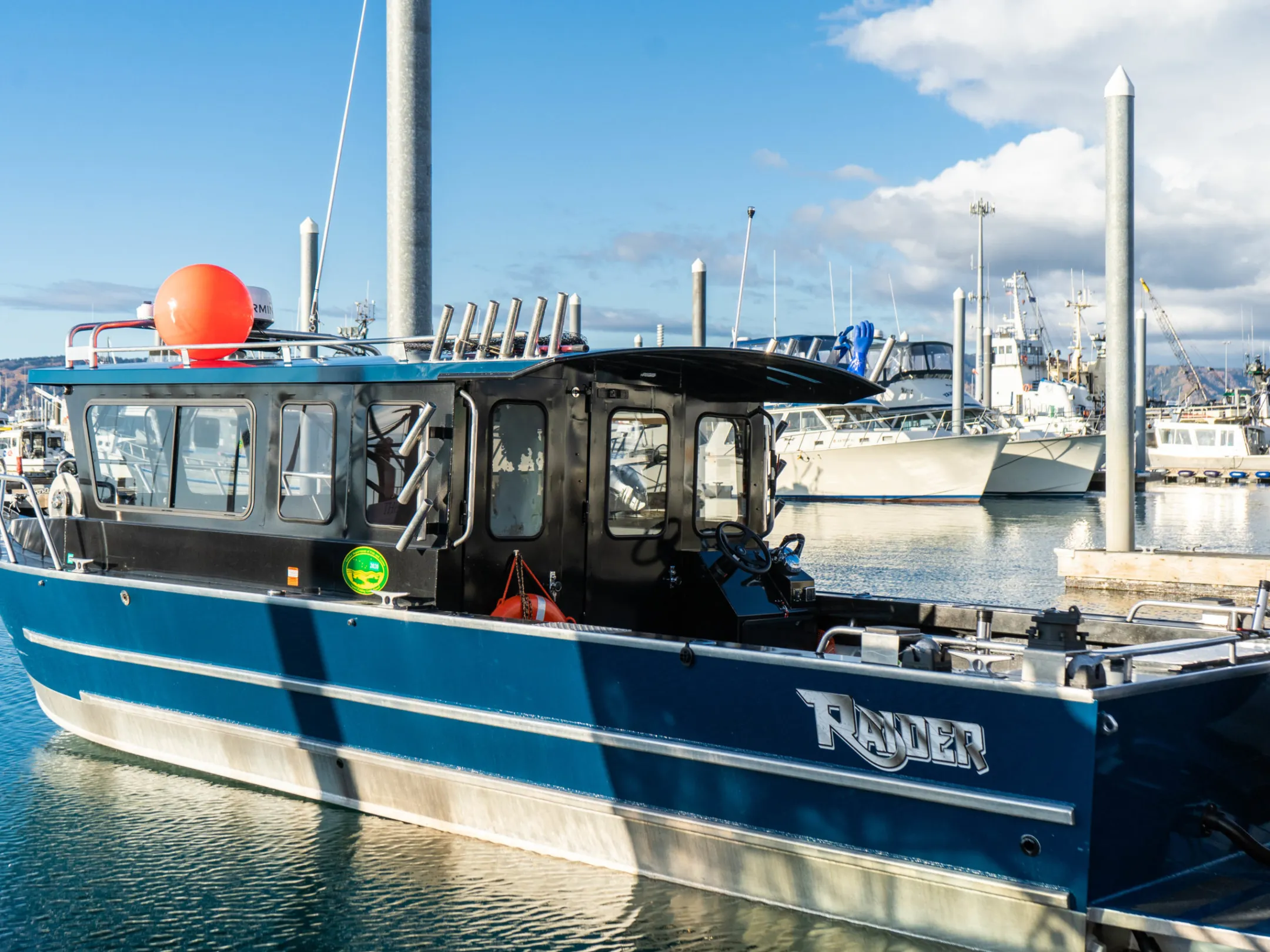 a boat is docked next to a body of water