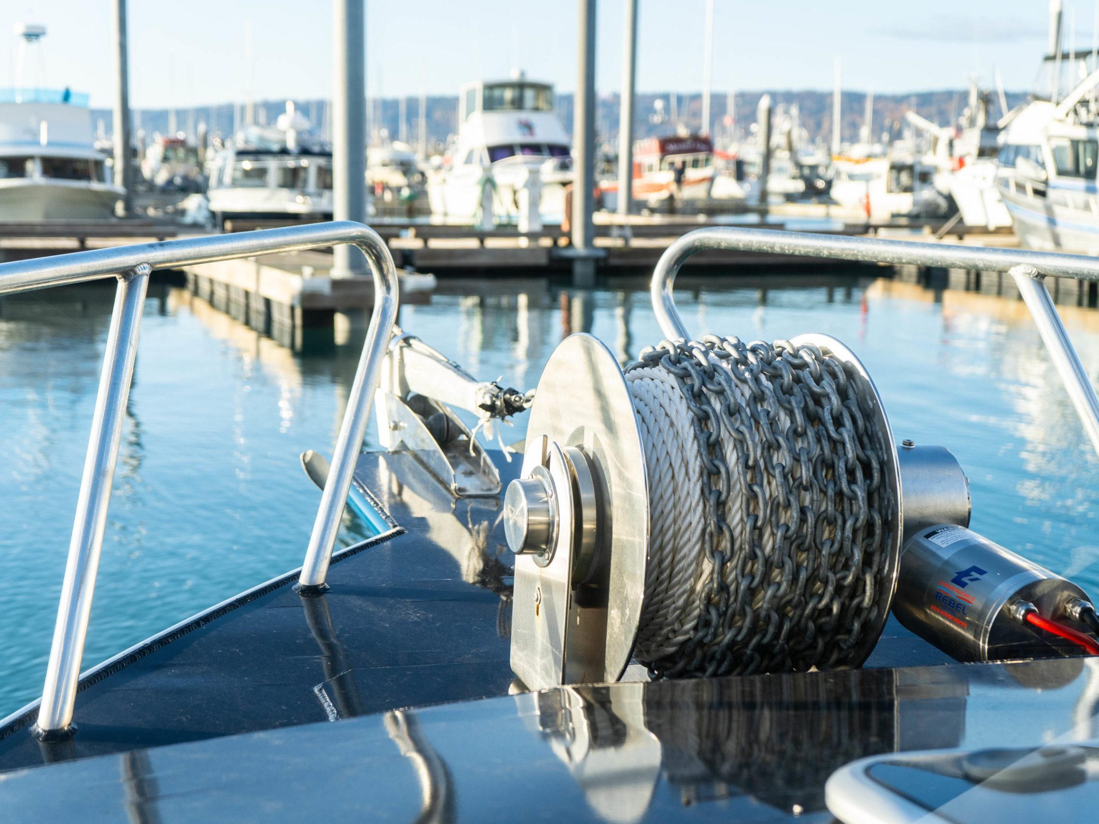 a boat that is sitting on a dock next to a body of water