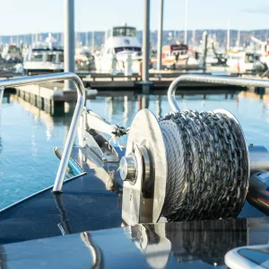 a boat that is sitting on a dock next to a body of water