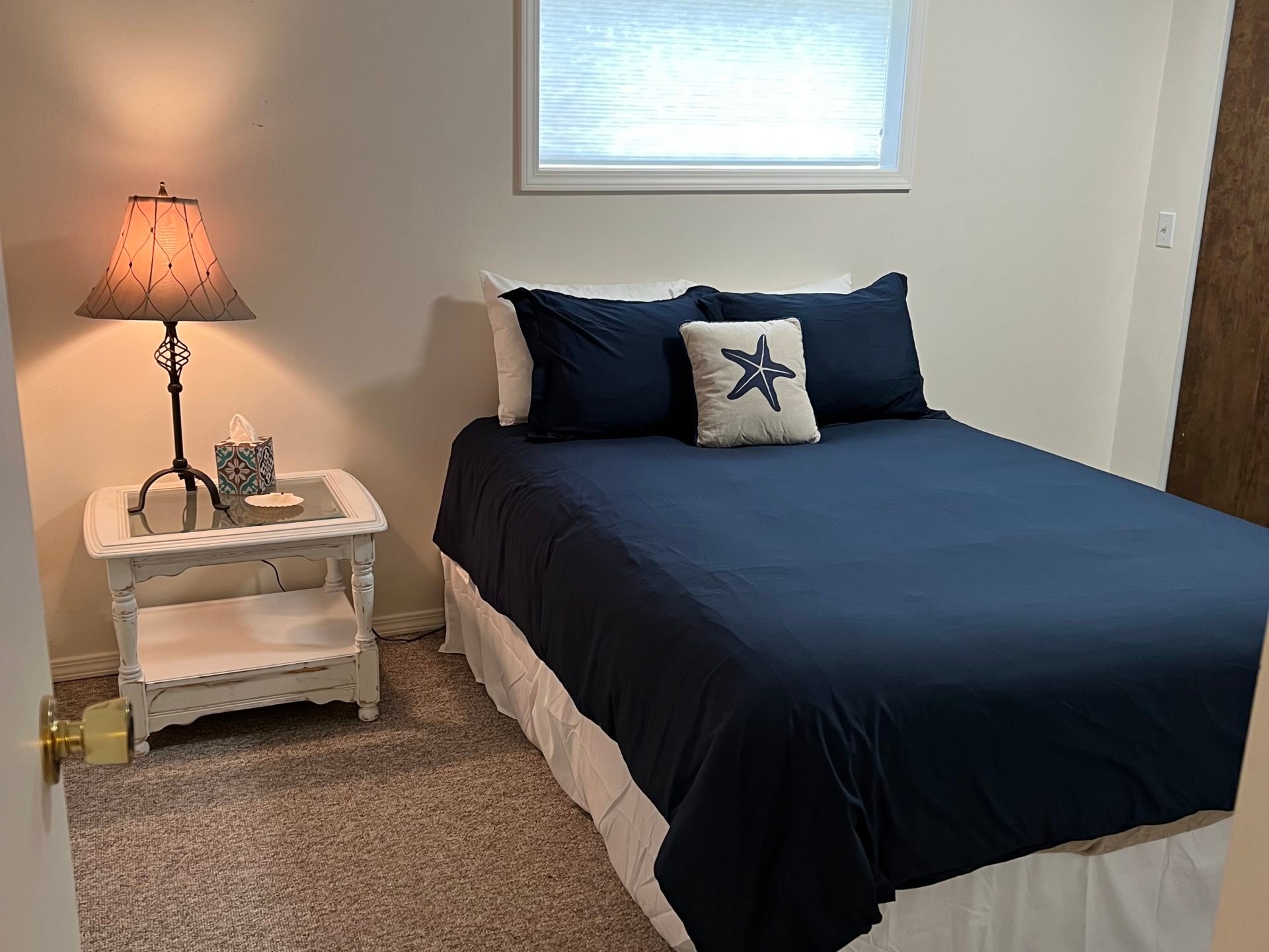 a bedroom with a bed in a room