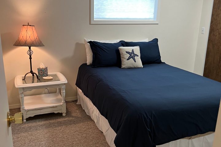 a bedroom with a bed in a room