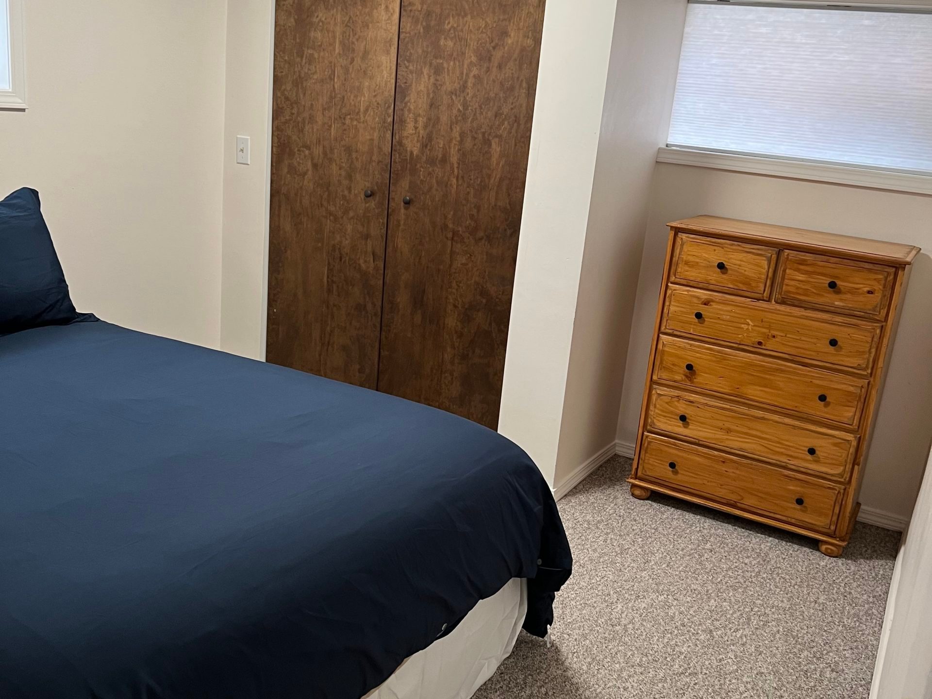 a bedroom with a bed in a room