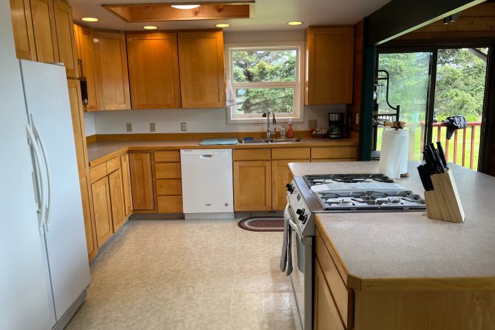 a kitchen with a wood floor