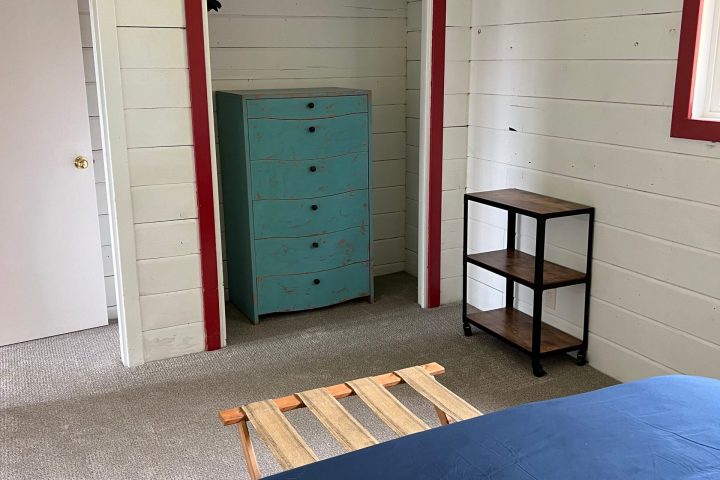a bedroom with a bed in a room