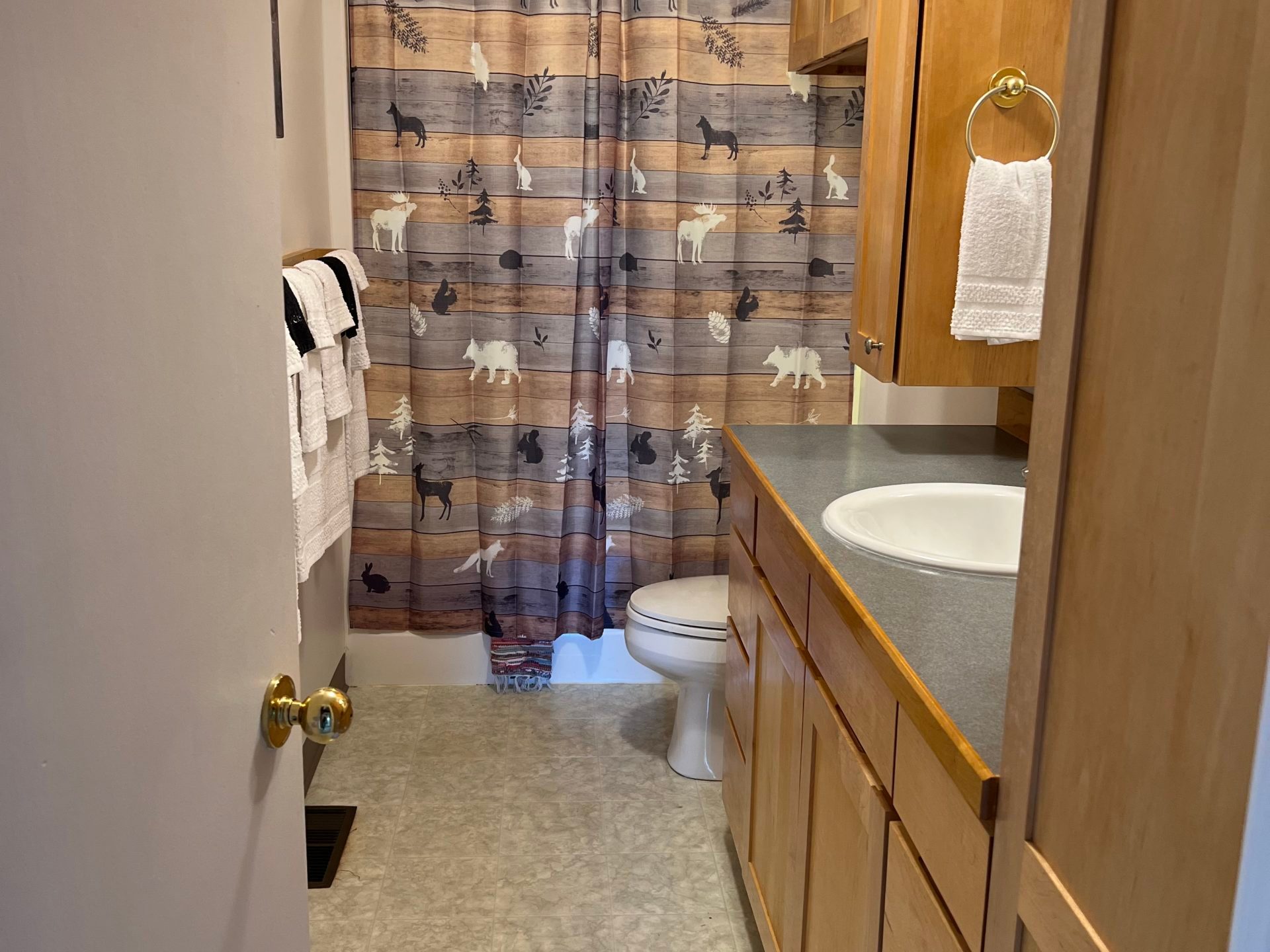 a kitchen with a sink and a mirror
