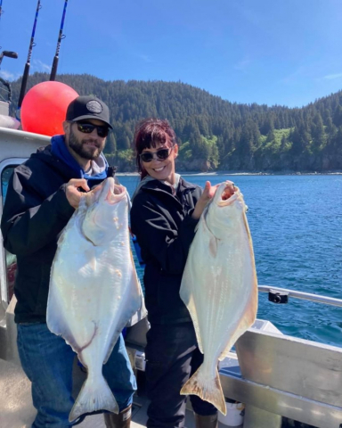a person holding a fish in the water