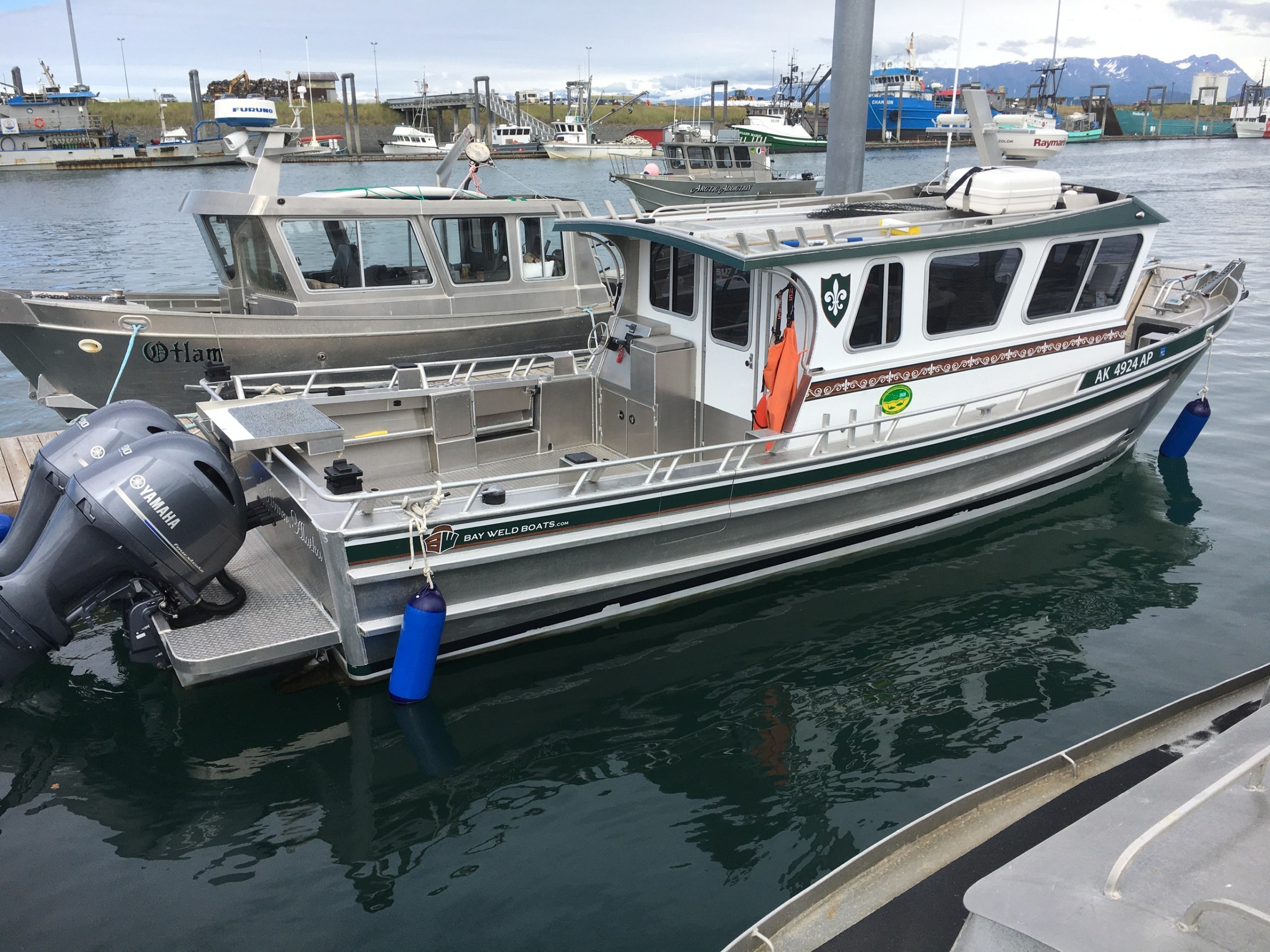 a boat is docked next to a body of water